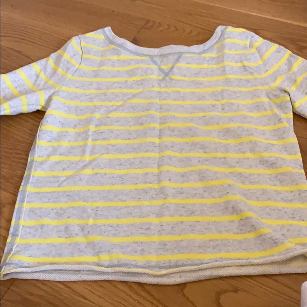 A neon yellow, greyish sweater.